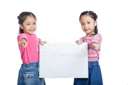 Asian Twin Sisters Hold A Blank Sign Point TO Camera Stock Photos ...