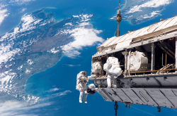 Astronauts Space Walking From The International Space Station Photo