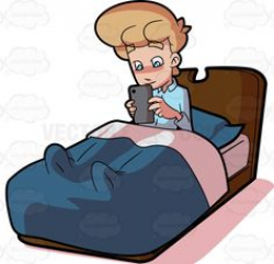 A Man Using His Mobile Tablet In Bed