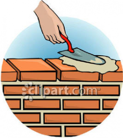 A Person Spreading Cement on a Brick Wall Using a Bricklaying Trowel ...