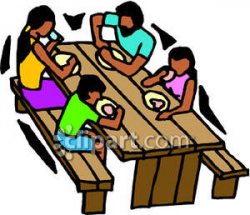 Family Eating At a Picnic Table - Royalty Free Clipart Picture