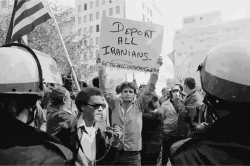 Man holding sign during Iranian hostage crisis protest, 1979 Icons ...