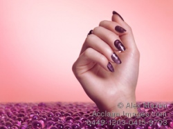 Acclaim Images - woman hand with purple nail polish photos ...