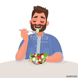 Man is eating a salad. Vegetarian. The concept of proper ...