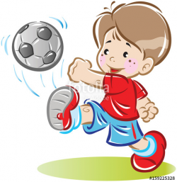 A little boy is playing with a soccer ball. Kicks him and ...