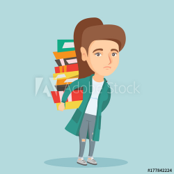 Young caucasian tired student carrying a heavy pile of books ...